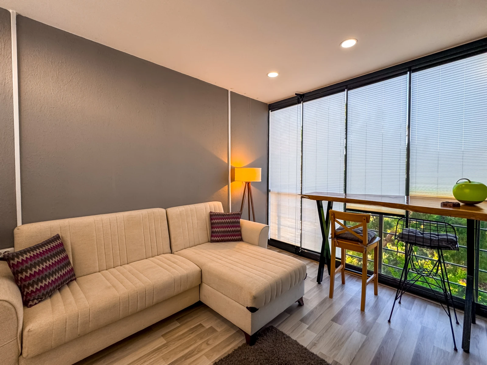 Superior 1+1 enclosed glass-walled veranda with sofa and study desk overlooking the garden