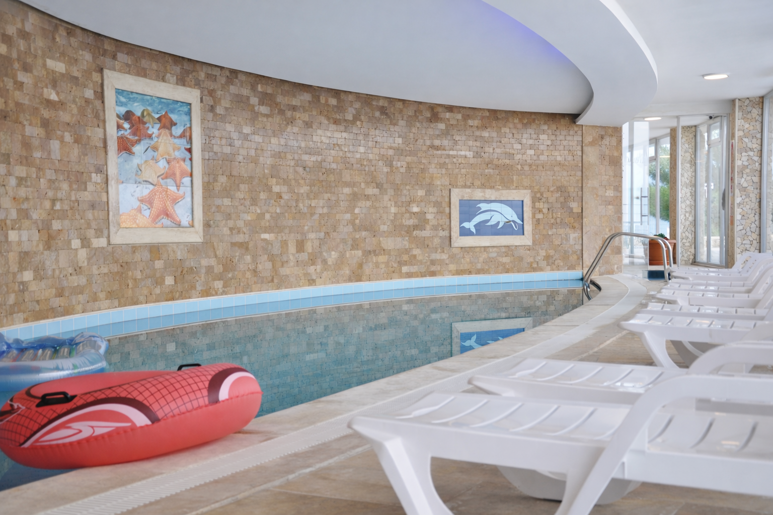 Heated indoor pool with sun loungers