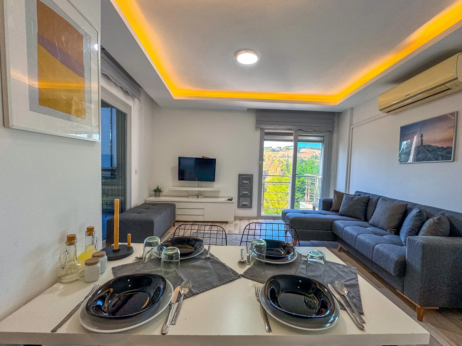 Open-plan living and dining area with kitchen alongside