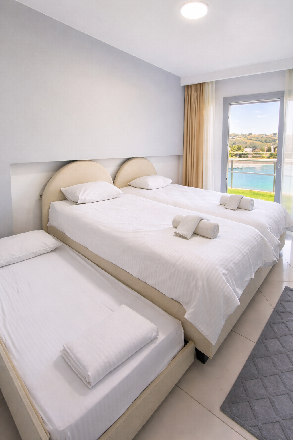 Second bedroom with twin beds, trundle and sea-view balcony