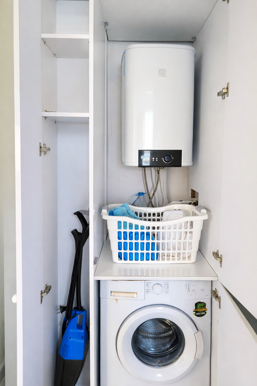 Utility cupboard with washing machine, water heater and storage